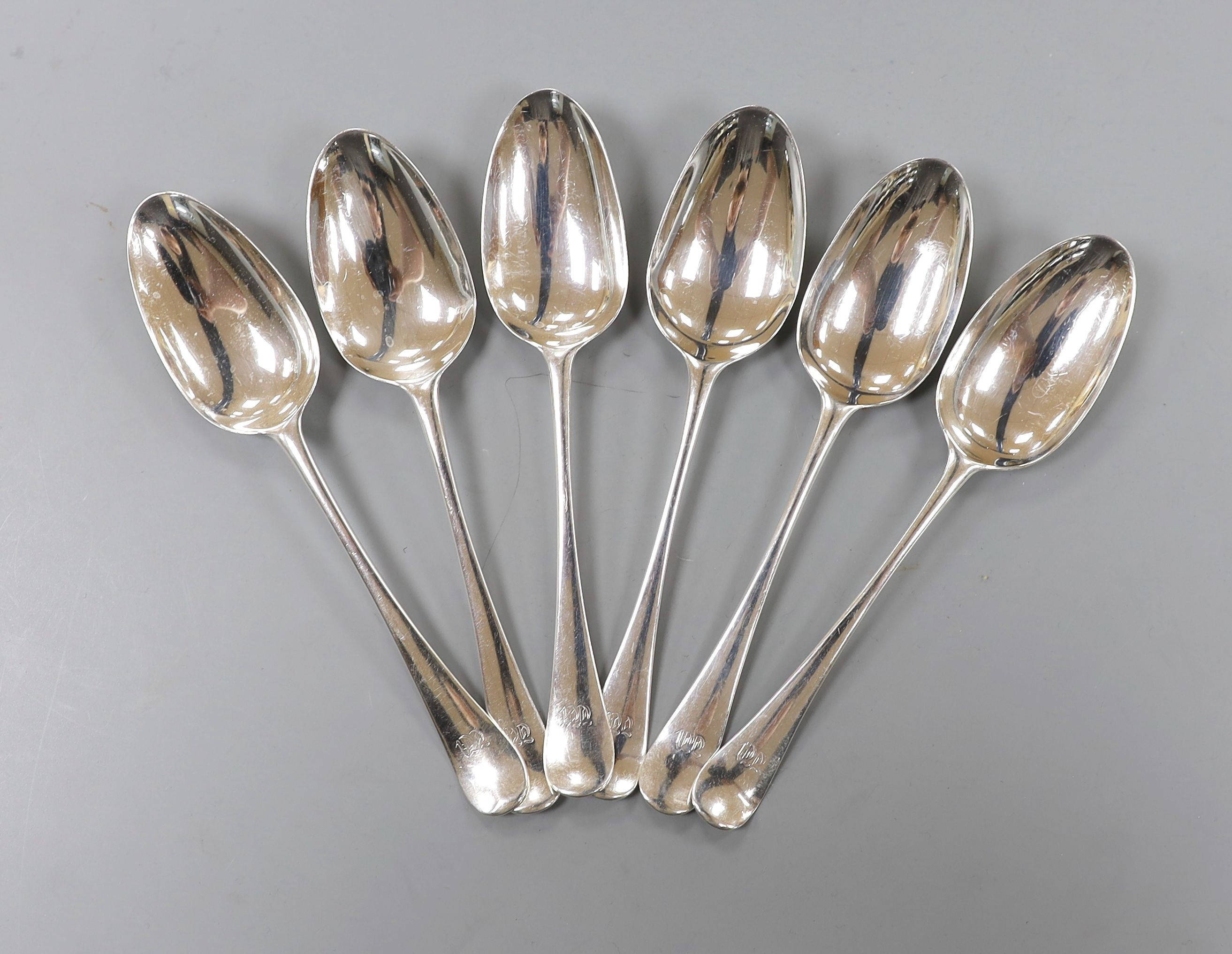 A set of six 18th century silver Old English pattern dessert spoons, indistinct marks, maker SW, possibly London, 1737, 16.5cm, 154 grams.